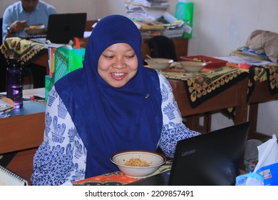 Bawang, Batang, Jawa Tengah, Indonesia - September 29 2022

Indonesian Teacher Is Taking A Break At The Office