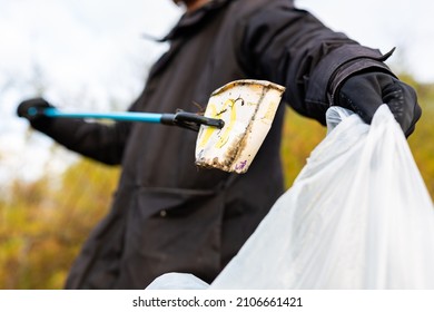 Bawdsey, Suffolk, UK January 06 2021: An Adult Male Doing A Beach Clean And Picking Up Litter And Discarded Rubbish. Litter Pick, Environmental, Beach Clean Concept