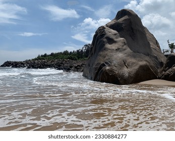 Bay of bengal sea shore beach with big stone at mahabalipuram
