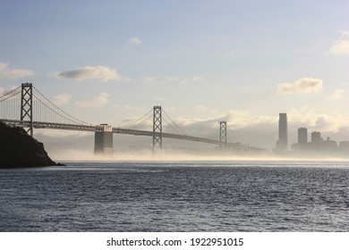 Bay Bridge Span Into The City San Francisco With Fog Rolling Underneath 