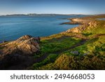 the bay and the coast of the Barents Sea in the evening at sunset near the village of Teriberka, Murmansk region