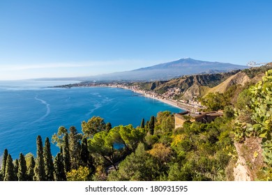 The bay of Giardini-Naxos with the Etna and Catania in the background viewed from Taormina, Sicily Italy. An HDR picture