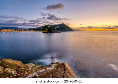 The Bay Of San Sebastian In Spain With Monte Igueldo At Sunset