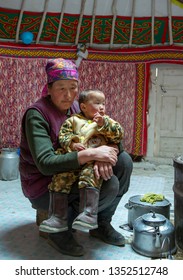 Bayan Ulgii, Mongolia, 28th September 2015: Mongolian Nomad Woman With Her Kid At Home