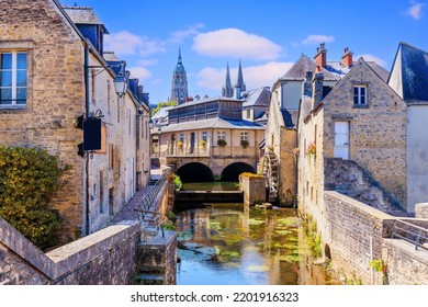 Bayeux, Normandy in northwestern France. The historic centre, the Notre Dame Cathedral and the Aure river. - Shutterstock ID 2201916323