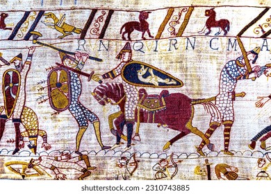Bayeux tapestry, bayeux, normandy, france. created 11th century after battle of hastings 1066 ad showing norman conquest. cavalry battle and deaths - Shutterstock ID 2310743885