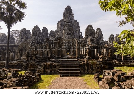 Bayon Temple is part of Angkor Thom which is in the Angkor Complex.  It is also known as the face temple with several towers featuring faces throughout the temple.
