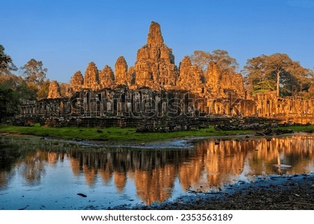 Bayon Temple at sunset in the Angkor Thom, the capital city of the Khmer empire, Siem Reap, Cambodia. Mahayana Buddhist temple built at the behest of Jayavarman VII, dating back to the 12th century.