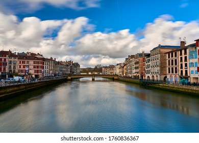 BAYONNE, FRANCE - 20 February 2020: Reflections of Bayonne city over Adur river