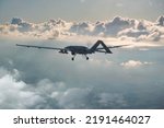 Bayraktar TB2, High-Altitude Long-Endurance, Unmanned Combat Aerial Vehicle. Bayraktar TB2 Unmanned aerial vehicle gliding through the clouds. 