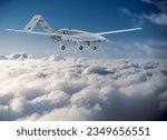 Bayraktar tb2 unmanned aerial vehicle gliding through the clouds. Bayraktar TB-2 combat drone in flight over the clouds.