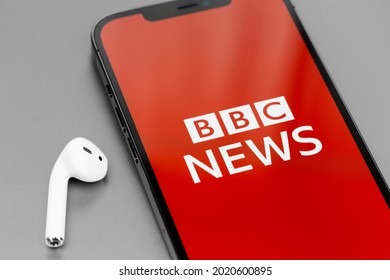 BBC News mobile logo app on screen smartphone iPhone with AirPods closeup. BBC News is an operational business division of the British Broadcasting Corporation. Moscow, Russia - July 20, 2021