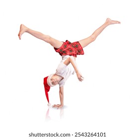 The b-boy in the Santa hat is doing a handstand with his feet up - Powered by Shutterstock