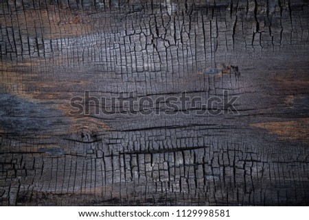 BBQ background. Burnt wooden Board texture. Burned scratched hardwood surface. Smoking wood plank background. Dark Burned wooden texture empty horizontal surface, copy  space. Halloween backdrop