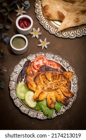 Bbq Chicken Breast Tikka With Salad And Mint Sauce Served In Dish Isolated On Dark Background Top View