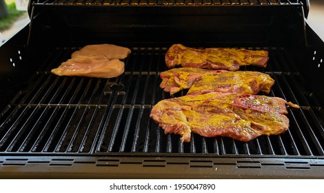 BBQ Chicken And Pork Steaks On A Hot Summer Sunday Afternoon In Southern Illinois, USA