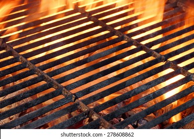 BBQ Flaming Grill And Glowing Coals Close-up Background Texture