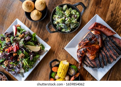 Bbq Food And Sides On Wood Table
Overhead Photo, Spread