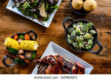 Bbq Food And Sides On Wood Table
Overhead Photo, Spread