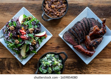 Bbq Food And Sides On Wood Table
Overhead Photo, Spread