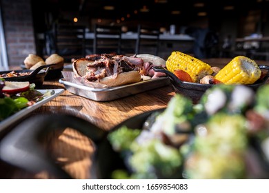 Bbq Food And Sides On Wood Table
Overhead Photo, Spread