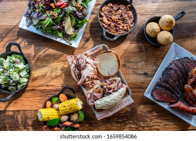 Bbq Food And Sides On Wood Table
Overhead Photo, Spread