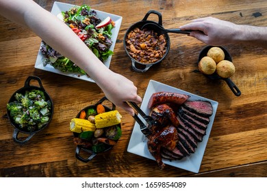 Bbq Food And Sides On Wood Table
Overhead Photo, Spread