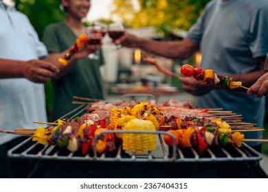 BBQ Fun Party with Grandparents, Family Gathering in the Garden, Summertime with grandpa, grandma, father and mother, BBQ Grill - Powered by Shutterstock