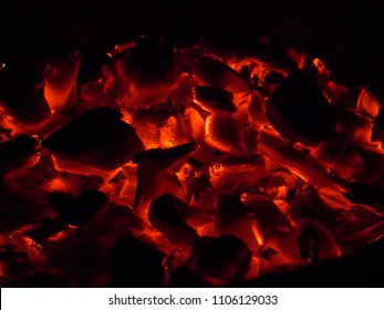BBQ Grill Pit With Glowing And Flaming Hot Charcoal Briquettes, Food Background Or Texture, Close-Up, Top View, embers, glowing coals, abstract backgroun. - Powered by Shutterstock