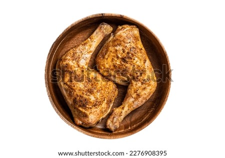 BBQ Grilled chicken legs in a wooden plate with herbs. Isolated on white background. Stock fotó © 