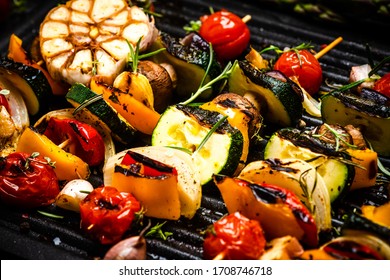 BBQ Grilled Wegetables on Skewers with Fresh Herbs and Spices. Summer Barbecue Food.
