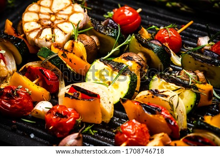 BBQ Grilled Wegetables on Skewers with Fresh Herbs and Spices. Summer Barbecue Food.
