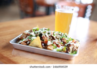 BBQ Nachos Served With A Beer