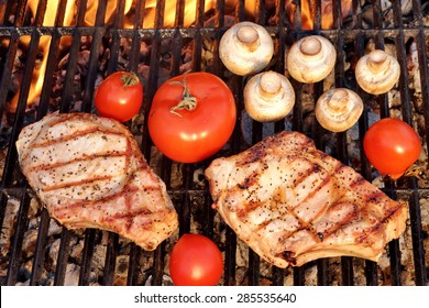 BBQ Pork Rib Pepper Steak, Tomato And Mushrooms On The Hot Flaming Charcoal Grill Overhead View