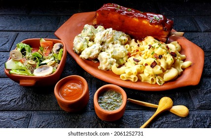 BBQ Pork Ribs With Potatoe Salad, Mac And Cheese, And Fresh Salad 