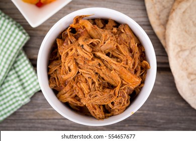 Bbq Pulled Pork Bowl Over A Wooden Plank Table