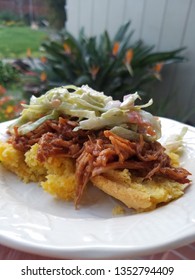 BBQ Pulled Pork On Jalapeno Cheddar Corn Bread Topped With Apple Cole Slaw