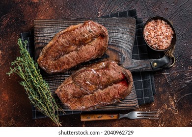 BBQ Roasted Shoulder Top Blade Cut Or Australia Wagyu Oyster Blade Beef Steak. Dark Background. Top View