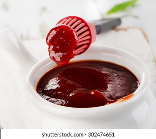 BBQ Sauce In  Bowl With A Brush. Selective Focus