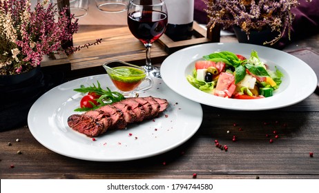 BBQ Skirt Steak With Vegetable Salad On Wooden Table, Two Courses Lunch Skirt Steak And Vegetable Salad