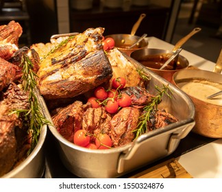 BBQ Station At A Buffet With Prime Rib, Lamb Rack And Sauces