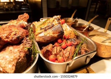 BBQ Station At A Buffet With Prime Rib, Lamb Rack And Sauces