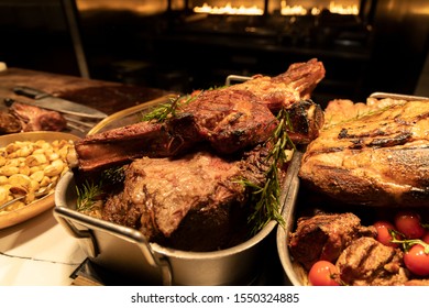 BBQ Station At A Buffet With Prime Rib, Lamb Rack And Sauces