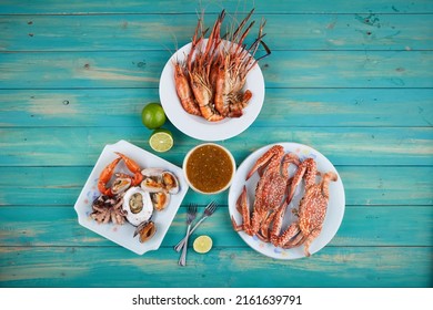 BBQ table seafood party with grilled shrimp squid, crab and thailand dipping sauce. Delicious Grilled barberque seafood Table outdoor  party home garden ready to eat