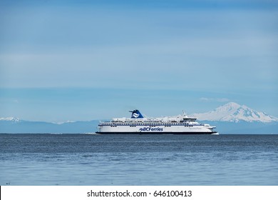 BC Ferries company passenger vessel Spirit of British Columbia on the sea with beautiful Mt Baker background 3. 
Photo taken at Galiano Island,BC Canada on 2017.05.22