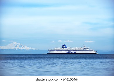 BC Ferries company passenger vessel Spirit of British Columbia on the sea with beautiful Mt Baker background 5.
Photo taken at Galiano Island,BC Canada on 2017.05.22
