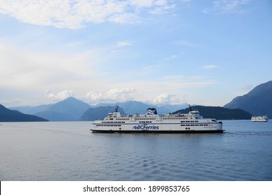 BC Ferries Queen of Cowichan ship on the beautiful Pacific ocean and mountains background. West Vancouver, BC, Canada. July 10, 2020