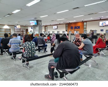 BCA Bank Customers Queue To Make Financial Transactions At Tellers Like BCA In Surabaya, Indonesia On April 10, 2022