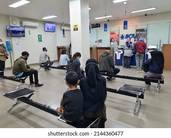 BCA Bank Customers Queue To Make Financial Transactions At Tellers Like BCA In Surabaya, Indonesia On April 10, 2022