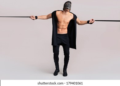 Bdsm Man With Leather Mask On Grey Background